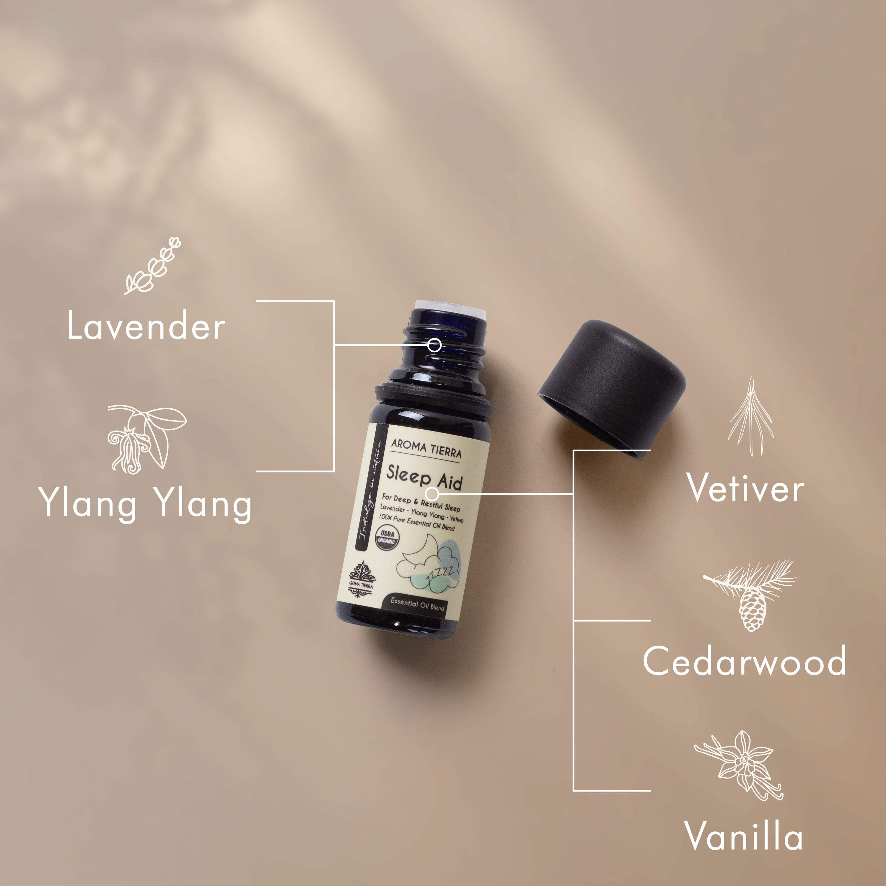 A bottle of Aroma Tierra Sleep Aid Essential Oil Blend, labeled for deep and restful sleep with natural essential oils.