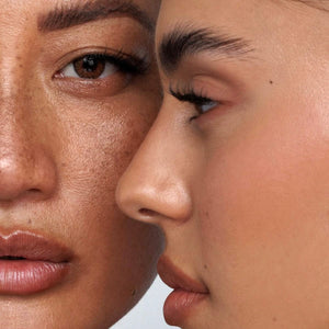 Close-up of two people's faces with a blurred background